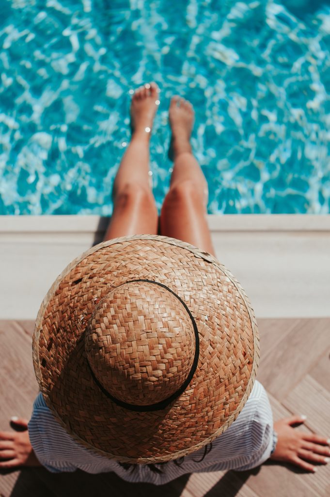 Chic wide-brimmed hats are a great suncare option for actors.